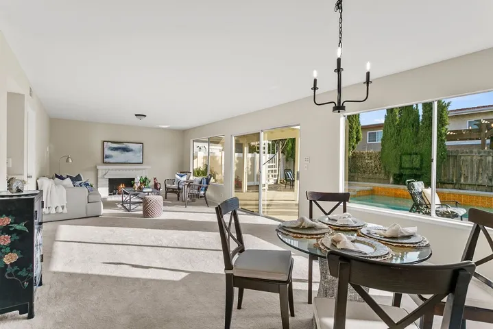 Casual dining overlooks the pool and firepit