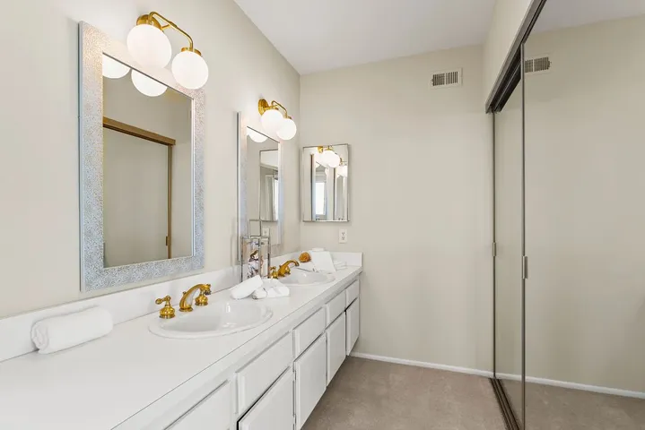 Newer lighting/mirrors at dual vanity