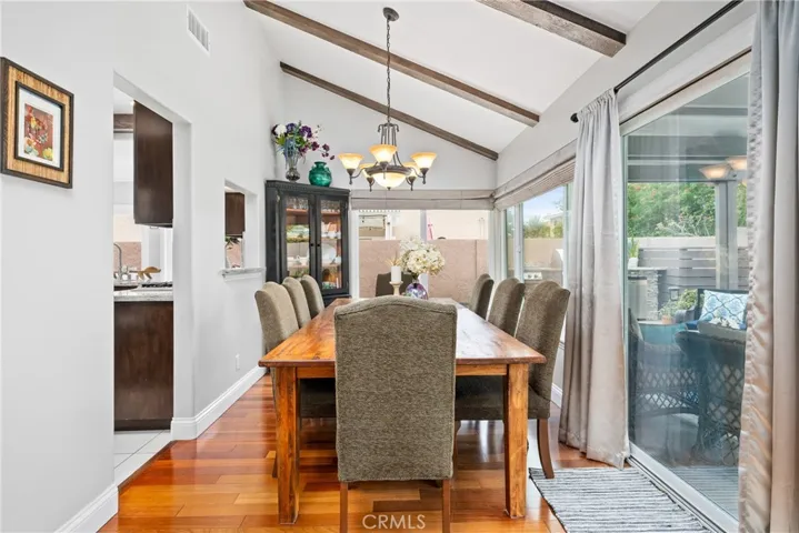 The dining room also has accented beams, adding to the custom and elegant design of the home.