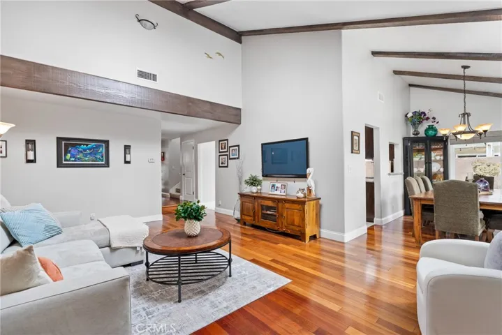 The family room features accent ceiling beams and lots of natural light!