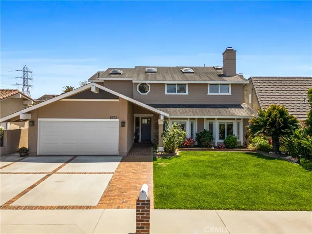 The pleasant curb appeal starts with the meticulously manicured front yard