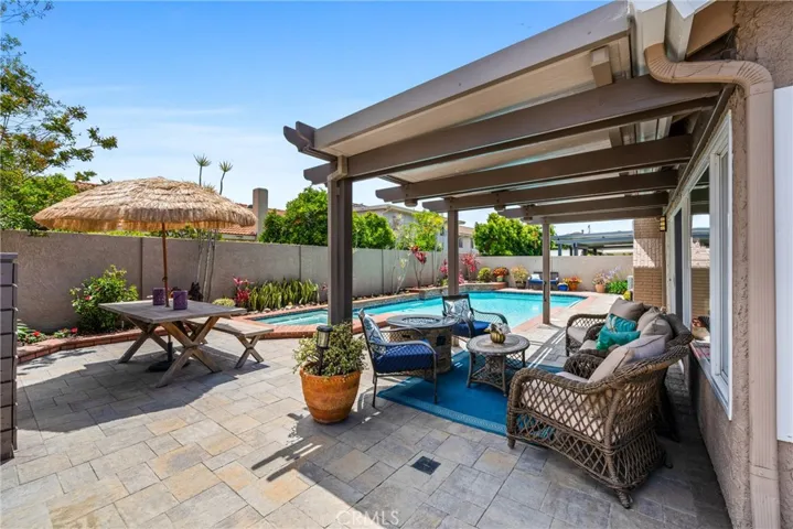 There is a new alumawood pergola that extends over a nice sitting area!