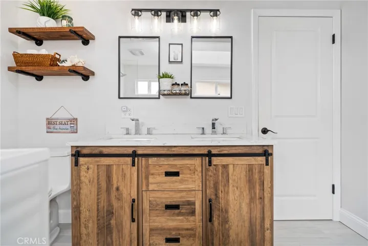 Efficiency meets style with dual vanity sinks set in shaker style cabinets.





