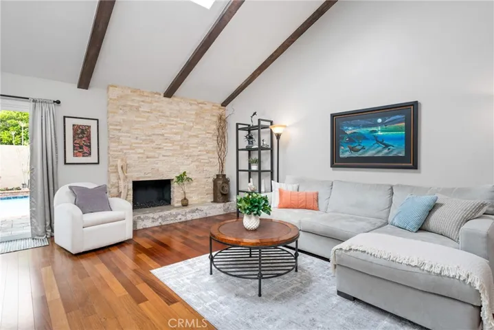 Enjoy the cozy gas fireplace and hearth with travertine tile and a stack stone facade.