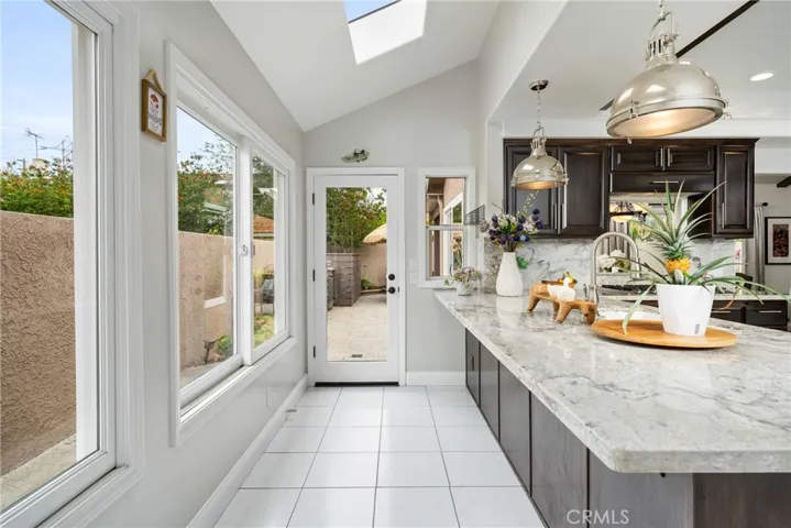 Large Peninsula, Breakfast Bar and a Door to the Backyard!
