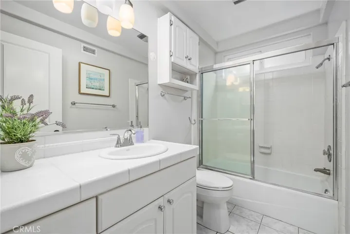 The secondary bedrooms share a full hallway bathroom with shower/tub & a hallway closet.
