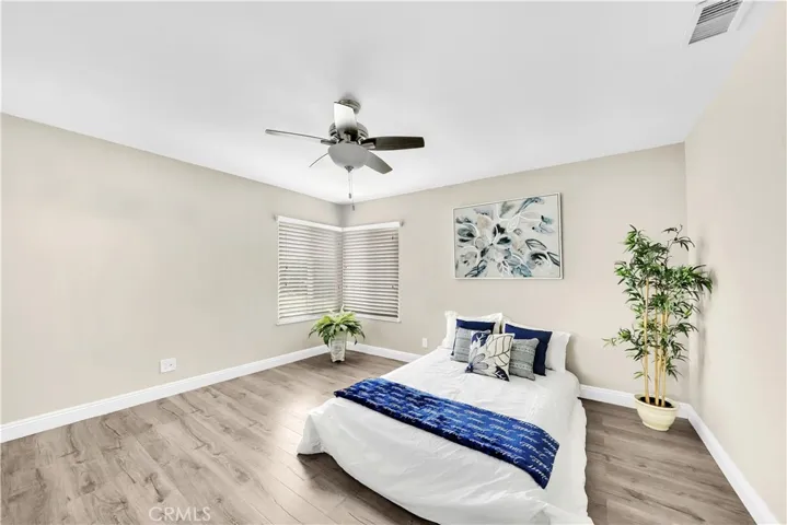 One of two bedrooms, engineered wood flooring, ceiling fan