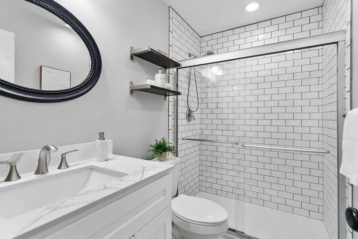 Downstairs bathroom has added shower not usually 
found in this floorplan.