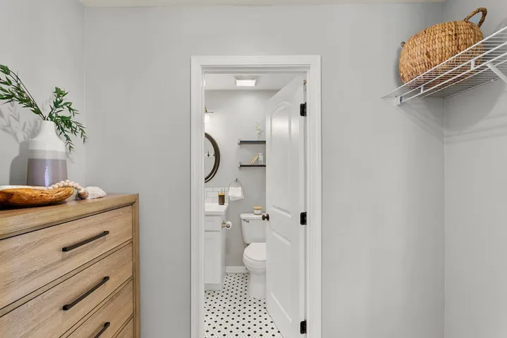 Primary closet area and direct access to bathroom.
