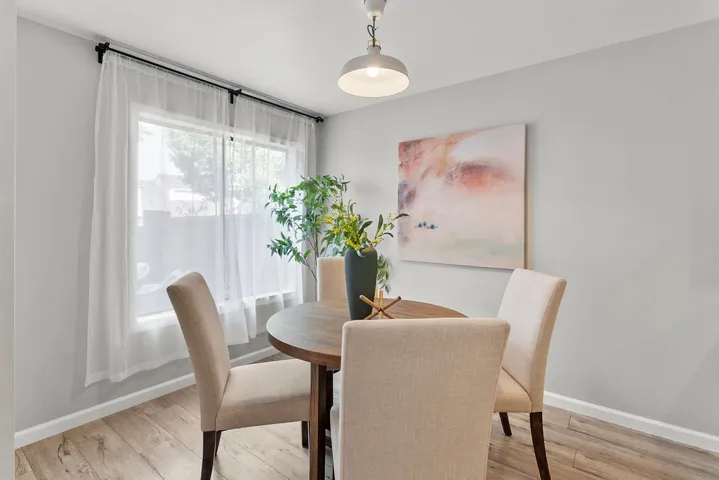 Dining area with large window to private patio.

