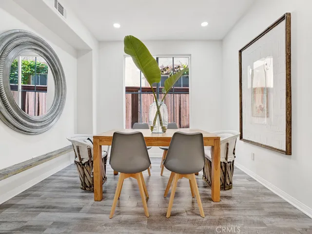 Formal dining room spacious for entertaining, recessed lighting, vinyl flooring
