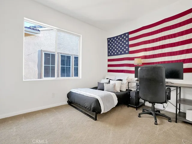 Bedroom 2 next to the primary suite spacious with large closet and plenty of room. Premium carpet.