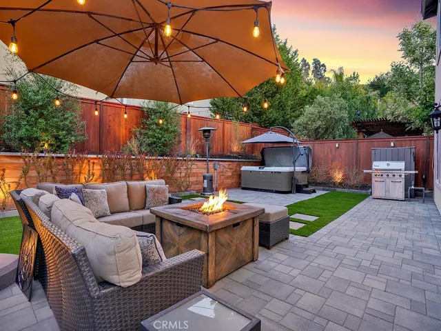 Beautiful Pavers, artificial turf, modern retaining wall and landscaping lights