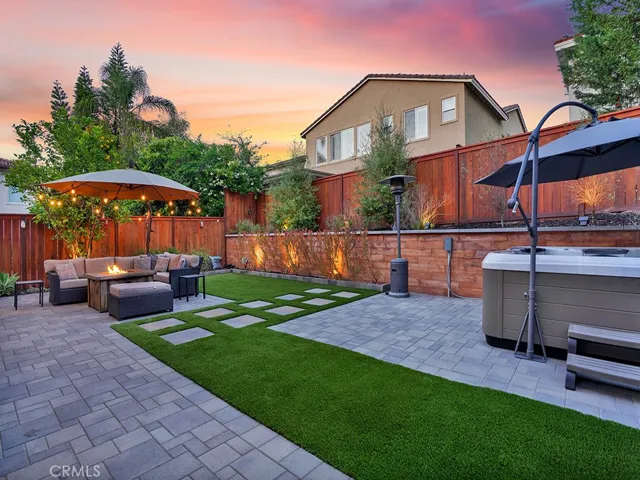 Low maintenance, artificial turf, pavers, and lights on a timer