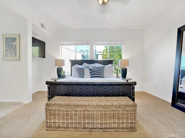 Primary Suite with natural lighting, beautiful carpet, freshly painted.