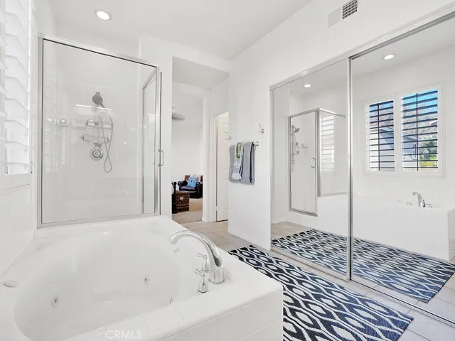 View from vanity in Primary Suite to the HUGE walk-in closet and the separate toilet room.