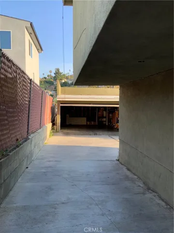 Driveway leading to garage.