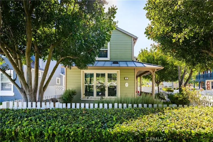 Plan C Surrey Farm home has approximately 1,650 sqft of living space. The HOA maintains all landscaping outside of the white picket fences. This particular home has extra landscaping in front which makes the front yard appear even larger than it is.