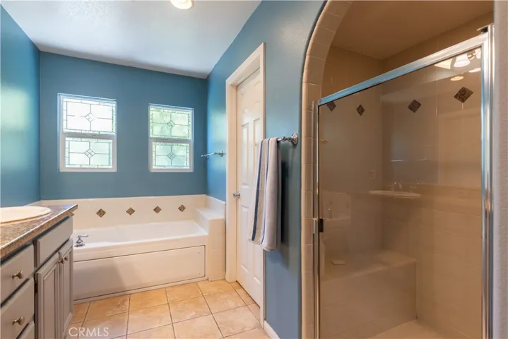 Beautiful tile shower with seat and arched design