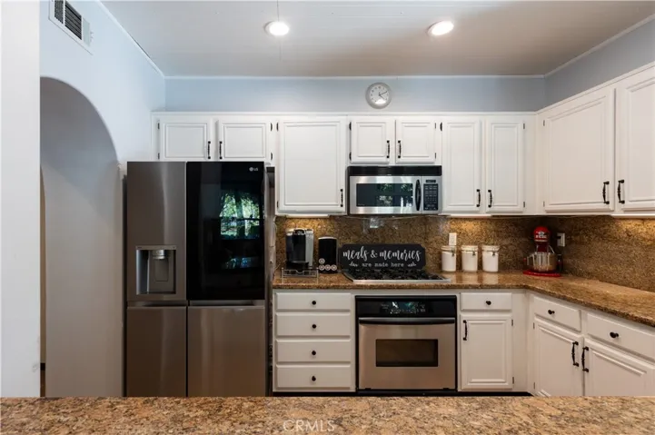 Stainless appliances, granite countertops and under cabinet lighting