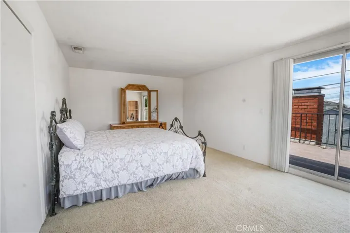 Upstairs Bedroom #1 with a  balcony