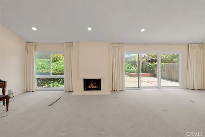 Living Room w/Fireplace & Vaulted Ceilings