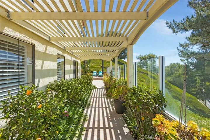 Lushly landscaped side yard with a view