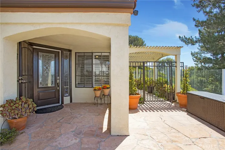 Covered front porch and a leaded glass front door