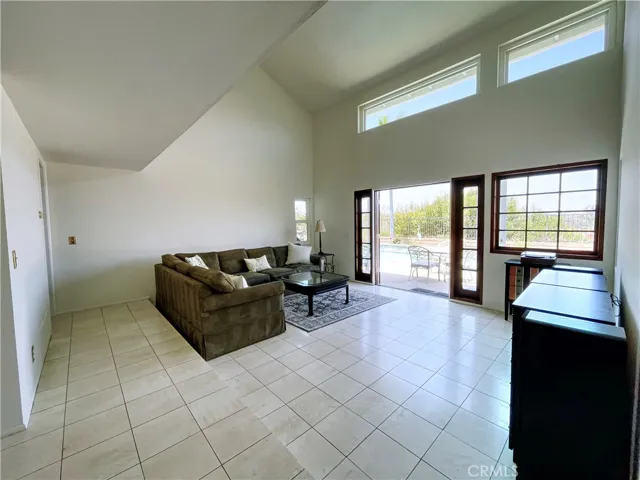 Living Room Views are of the swimming pool and city