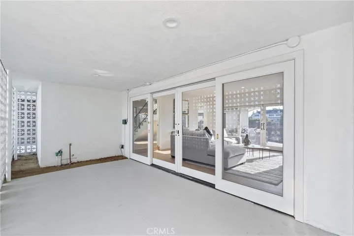 PATIO OFF OF THE FAMILY ROOM FACING THE FRONT OF THE HOUSE