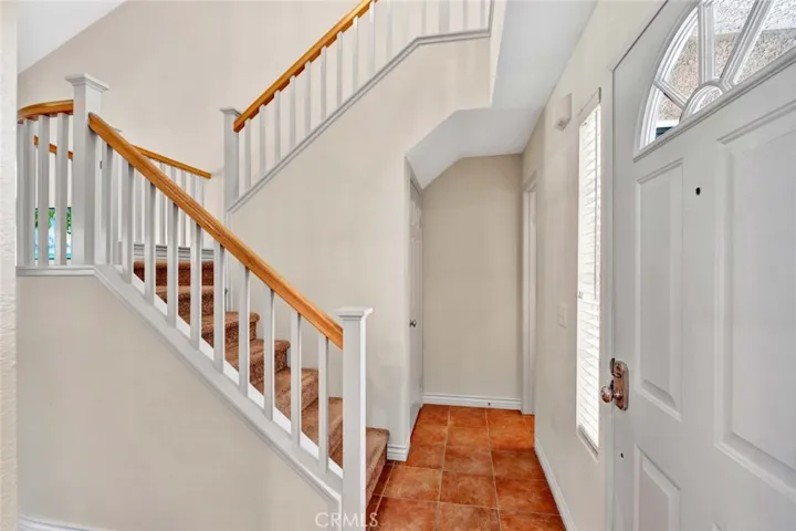 Open stairwell leads to upstairs bedrooms