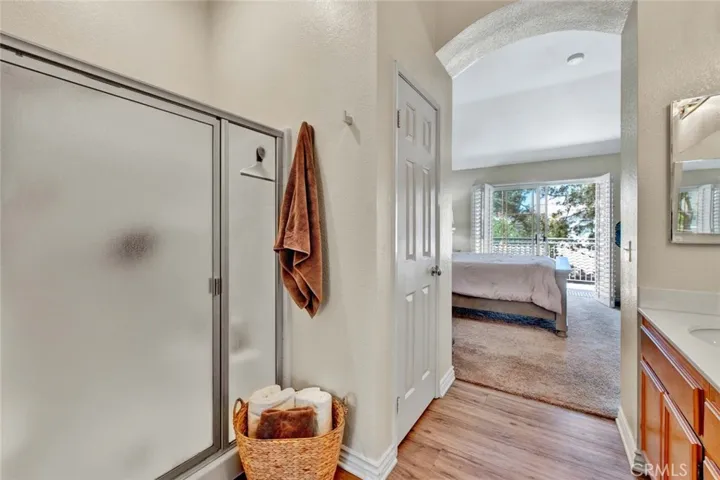 Walk-in shower and walk-in closet with private toilet area