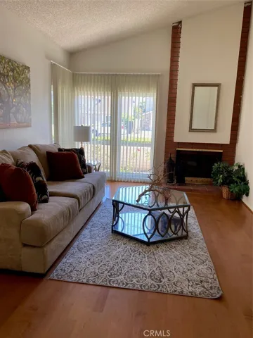 Open Living Room with High Ceilings & Fireplace