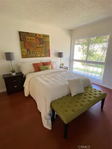 Master Bedroom with New Laminate floors and Mirrored Closets