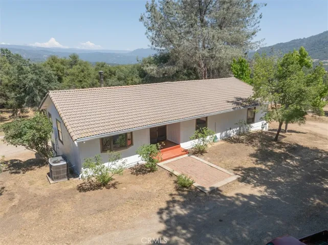 The front of the house has a circular driveway