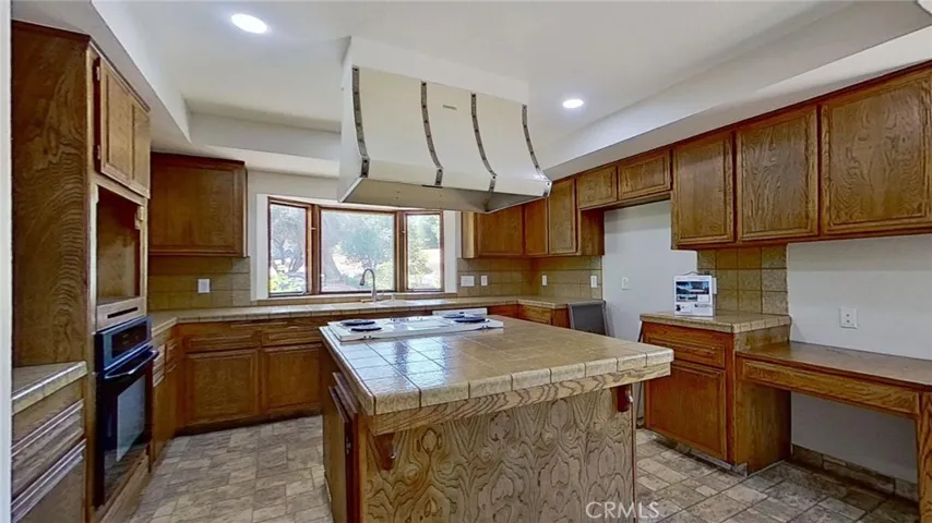 The kitchen has a pantry and the cooktop has a built-in griddle