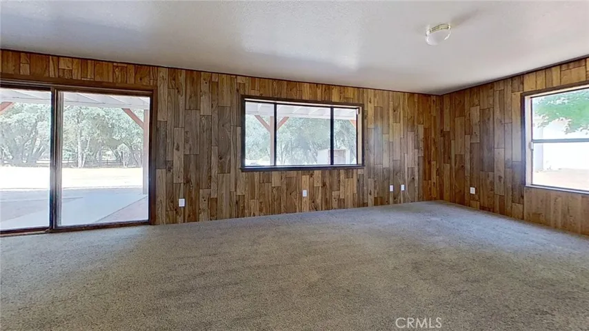 Family room has a slider to the rear pavewr brick patio