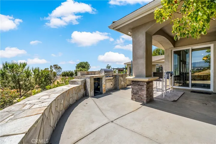 Secondary patio and built in bbq area outside informal dining area and kitchen...perfect spot for morning coffee or afternoon and evening relaxation
