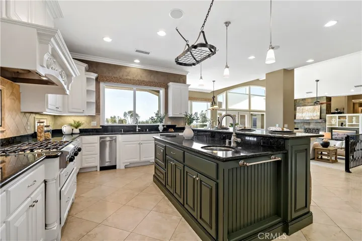 Gorgeous kitchen w sink in center island and breakfast bar