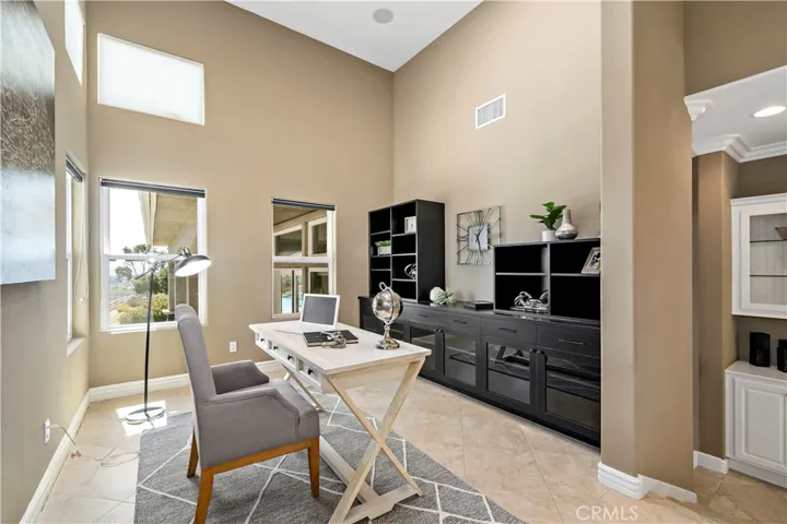 Elevated office multi-use space w built in wall unit
