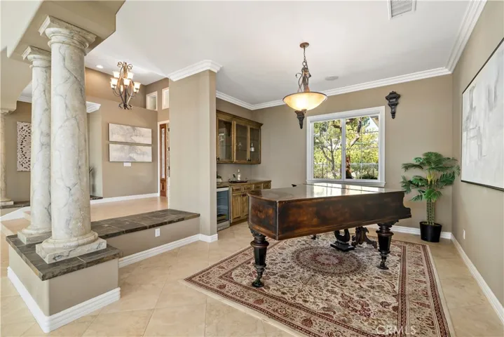 Formal dining area currently set up w grand piano