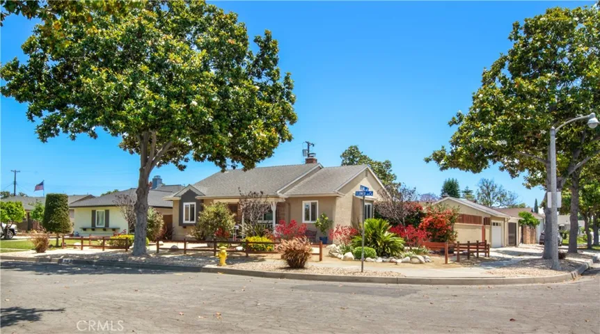 View at corner lot and in the backdrop at the side of your beautiful home lies a large, paved space perfect for an RV.
