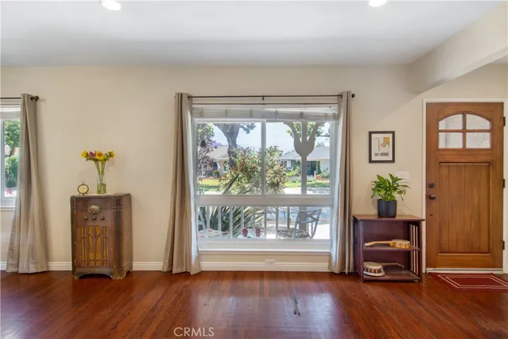 Living room facing front yard big windows allowing beautiful natural light to flood into your home.