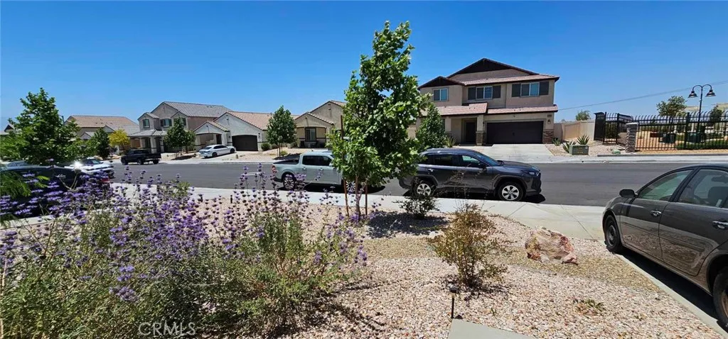 basketball court in the front of the home