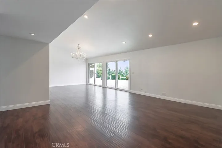Living room with open floorplan to family room or dining room