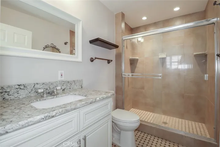 Full bathroom off of laundry and kitchen