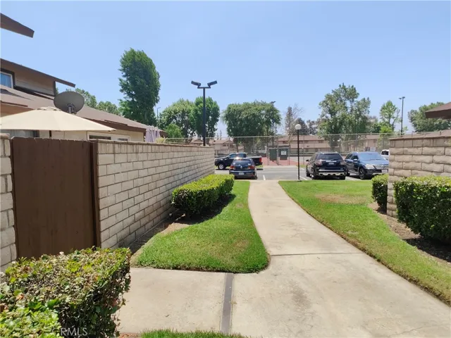 VIEW LOOKING SOUTH TOWARDS THE TWO TENNIS COURTS