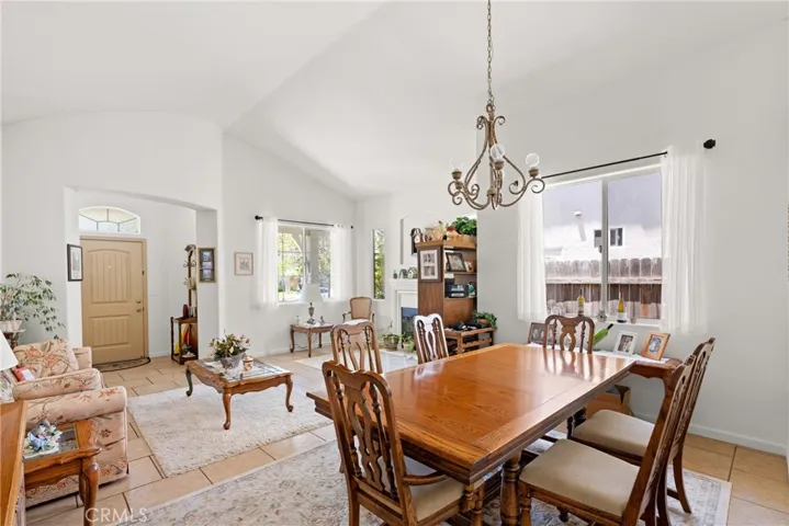 Dining Area With Living Room In The Background