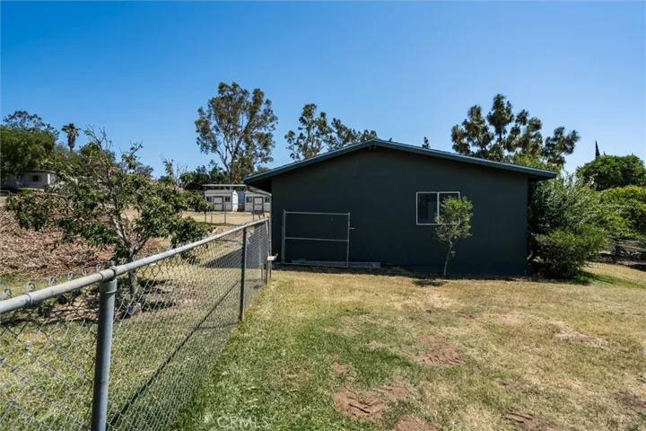 Outbuilding with storage for your riding lawnmower, tools, etc.