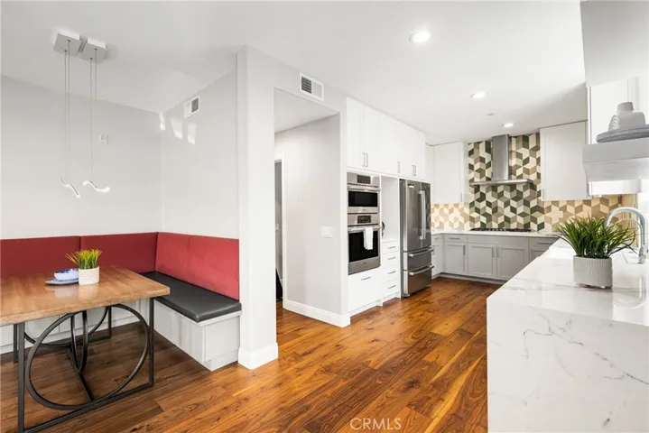 Entrance to bedroom and bath in hall behind kitchen